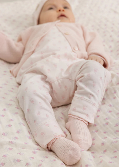 Romper Rula Mini Bloom – modal & organic cotton – MarMar Copenhagen: baby lying on back in the floral romper.