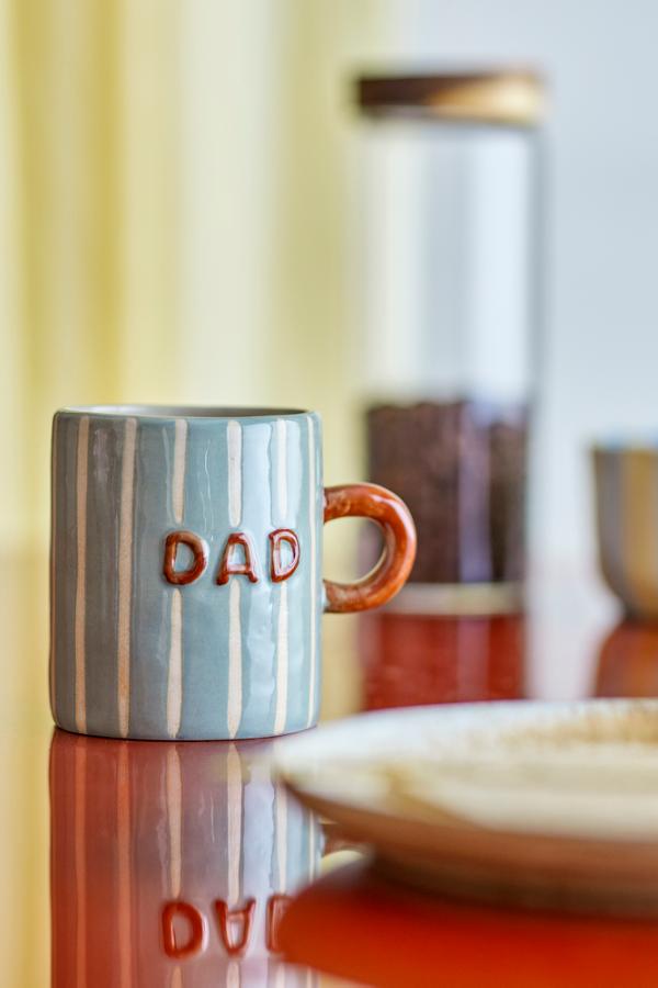 Cherish Mug Blue – Hand-painted ceramic mug with Dad – Bloomingville: blue mug on a table with the word Dad.